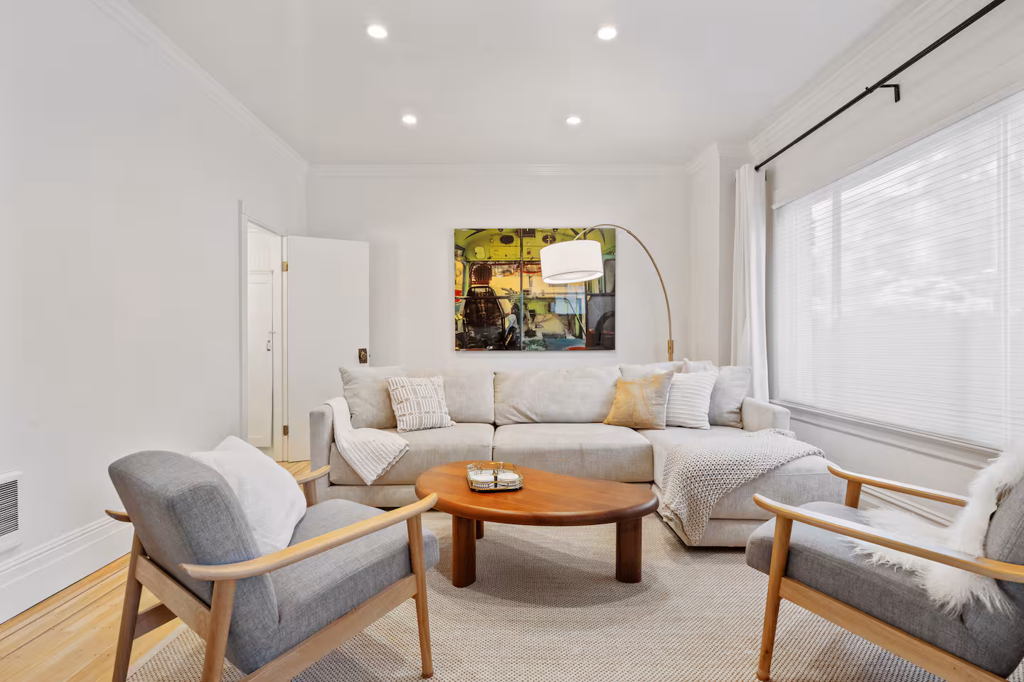 Living room with high ceilings and exposed wood beams at Casa Noe Heights, Noe Valley, San Francisco